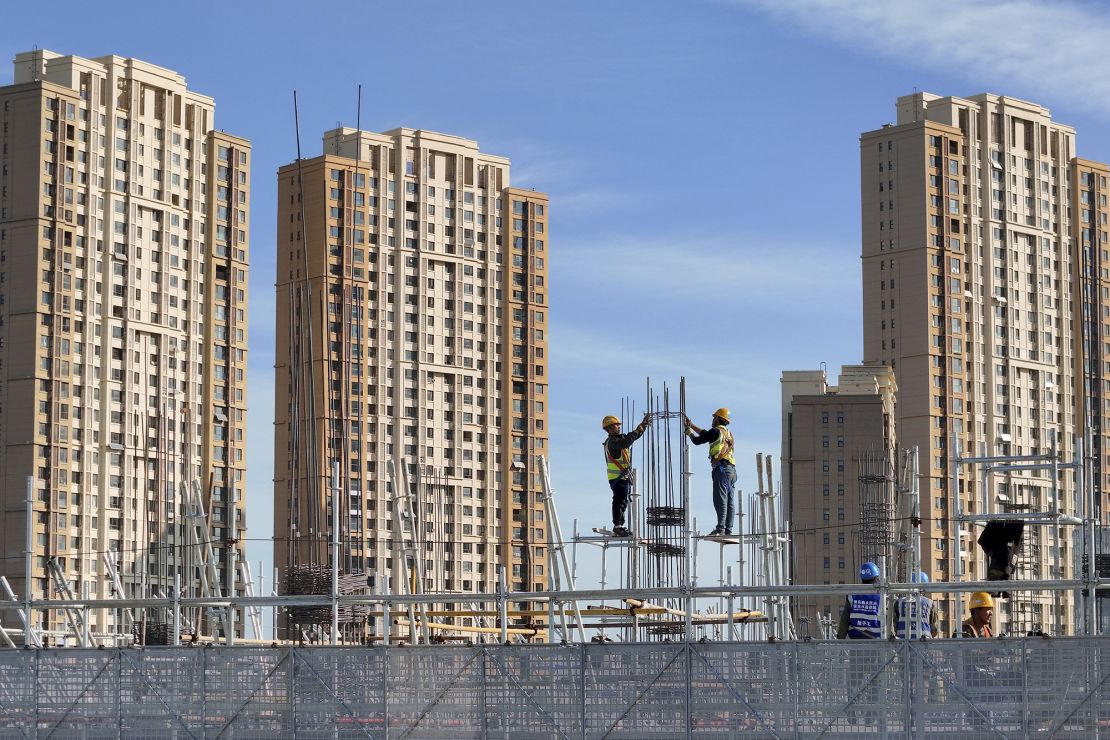 Workers at a construction site in Yantai in east China's Shandong province on November 4, 2023. Analysts say the property downturn is likely to drag on, hobbling China's growth prospects for years.