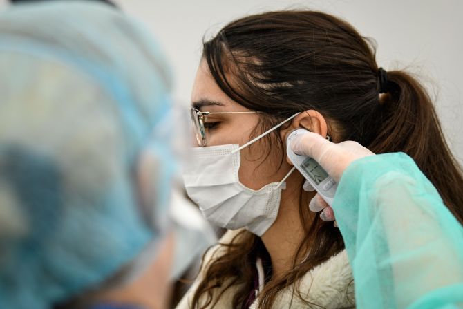 This ear thermometer is being used at a medical center in Paris. Thermometers that measure the infrared energy emitted from the eardrum were <a href=