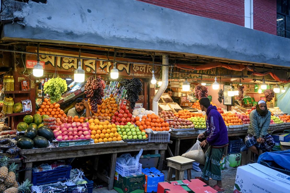 Fruit sellers at a wholesale market in Dhaka on January 21, 2024