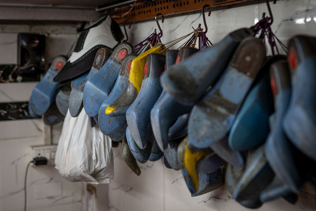 Shoe models hang in Shah’s workshop in Mumbai on April 14, 2024.