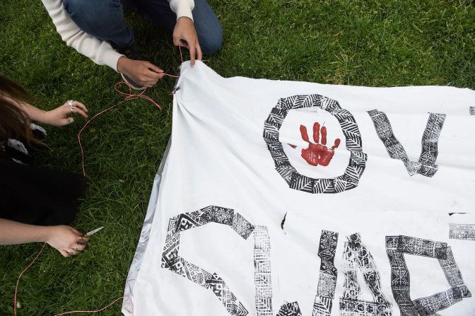 Demonstrators work on a banner April 24 at Swarthmore College in Swarthmore, Pennsylvania.