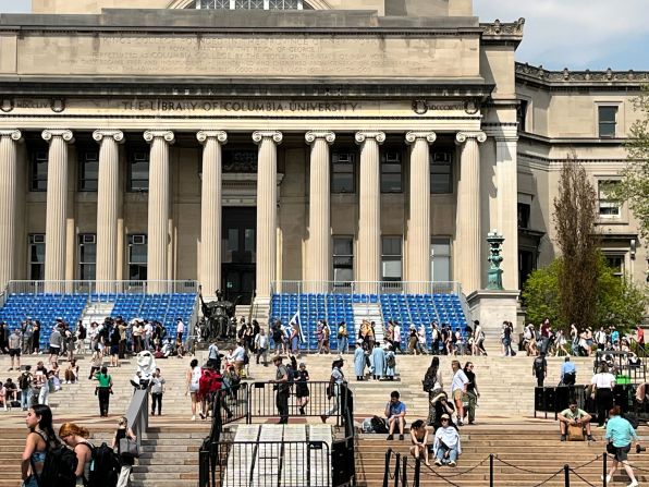 Demonstrators march past Low Library while chanting 