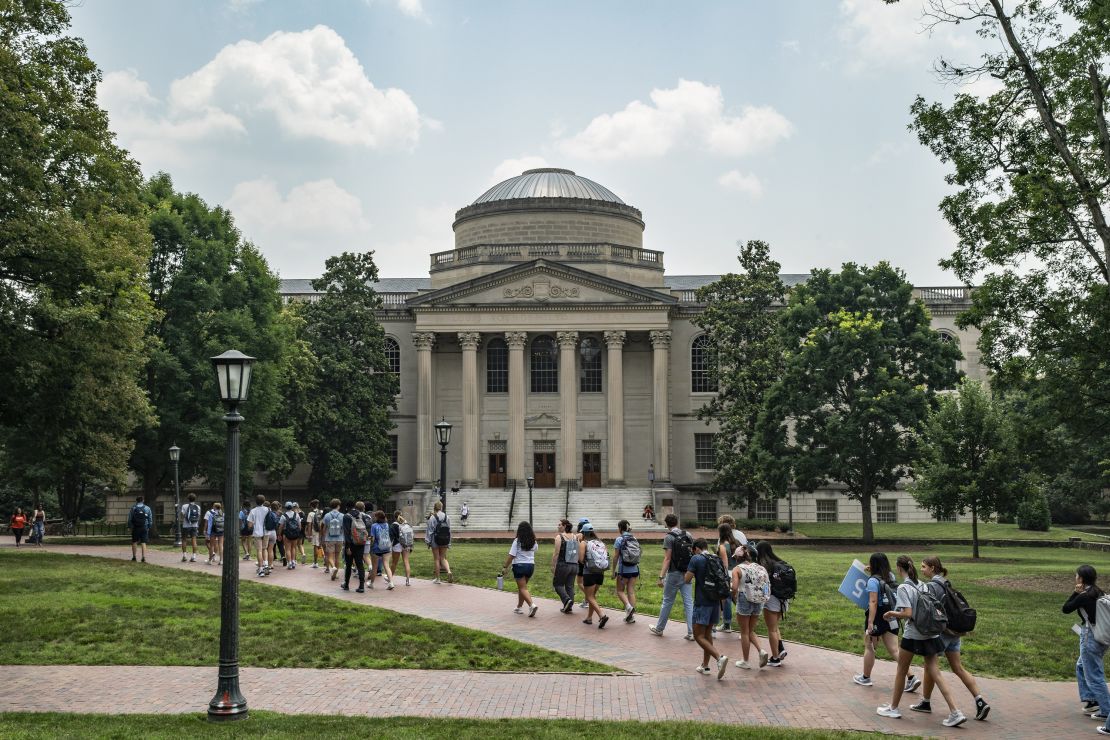 People walk on the campus of the University of North Carolina Chapel Hill on June 29, 2023. The Biden administration canceled $168 billion in student loan debt for 4.8 million Americans.