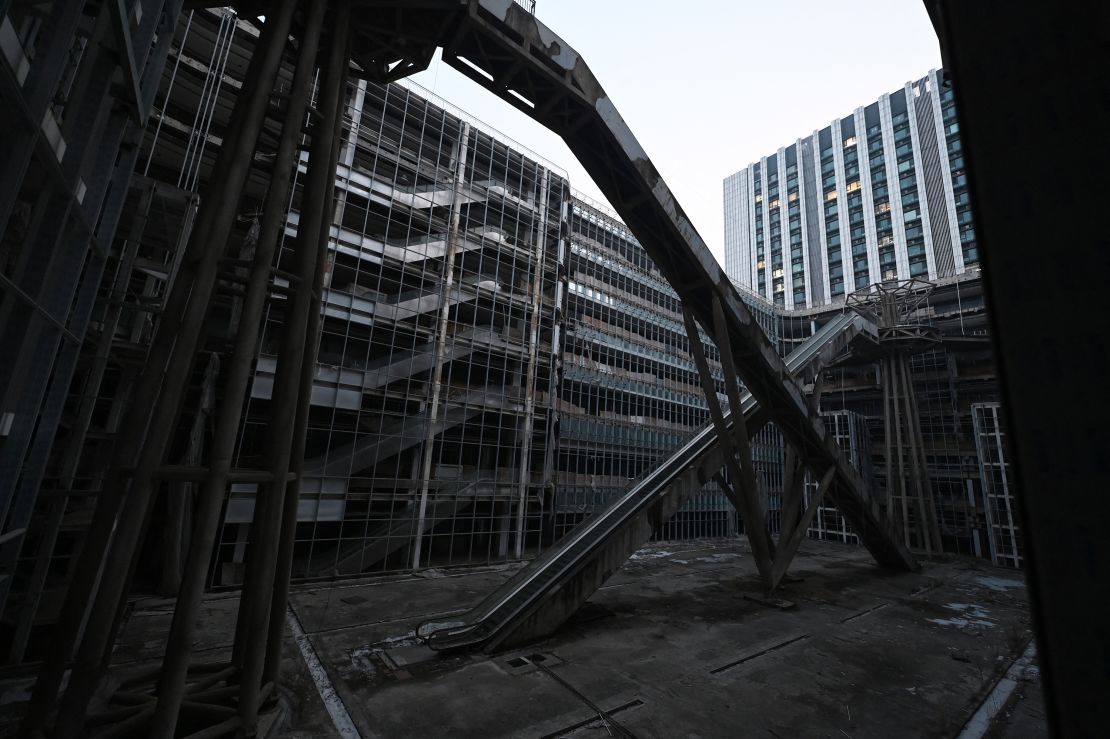 TOPSHOT - Escalators are seen in an abandoned Evergrande commercial complex in Beijing on January 29, 2024. A Hong Kong court on January 29 ordered the liquidation of China's property giant Evergrande, but the firm said it would continue to operate in a case that has become a symbol of the nation's deepening economic woes. (Photo by GREG BAKER / AFP) (Photo by GREG BAKER/AFP via Getty Images)